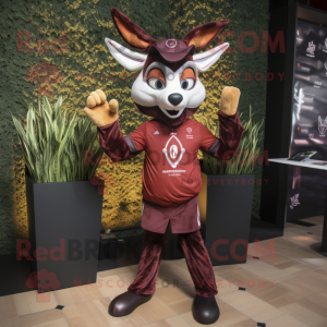 Maroon Gazelle mascot costume character dressed with a Graphic Tee and Wraps