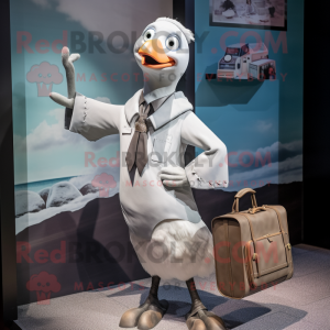 Silver Seagull mascot costume character dressed with a Shift Dress and Briefcases