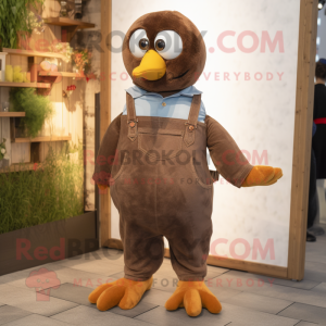 Brown Dove mascot costume character dressed with a Dungarees and Smartwatches