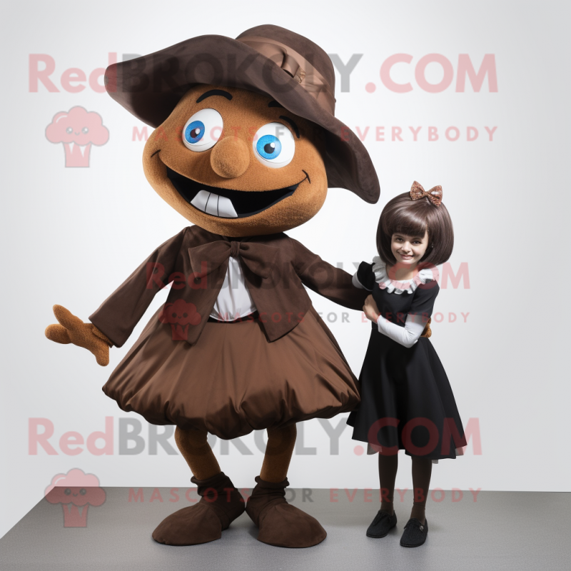 Brown Witch mascot costume character dressed with a Mini Skirt and Bow ties Brown Witch mascot costume character dressed with a Mini Skirt and Bow ties