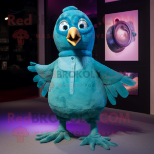 Turquoise Pigeon mascot costume character dressed with a Romper and Foot pads
