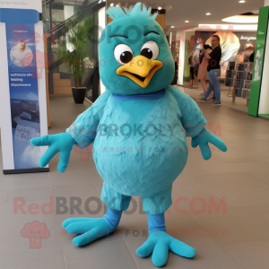 Turquoise Pigeon mascot costume character dressed with a Romper and Foot pads