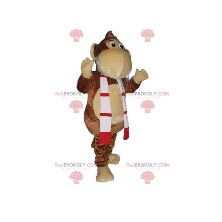 Mascota divertida del mono con una bufanda roja y verde -