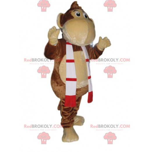 Mascota divertida del mono con una bufanda roja y verde -