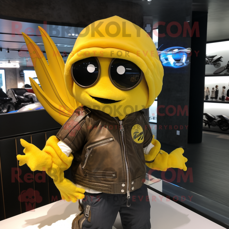 Lemon Yellow Betta Fish mascot costume character dressed with a Biker Jacket and Shawls Lemon Yellow Betta Fish mascot costume character dressed with a Biker Jacket and Shawls