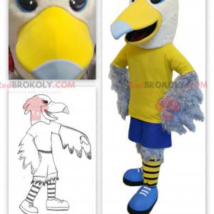 Mascotte d'aigle jaune et blanc en tenue sportive -