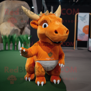 Orange Triceratops mascot costume character dressed with a Polo Tee and Rings