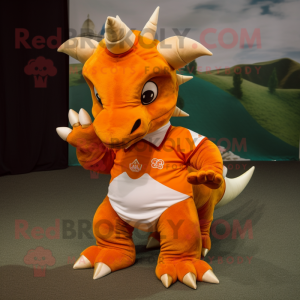 Orange Triceratops mascot costume character dressed with a Polo Tee and Rings