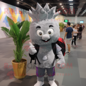 Gray Pineapple mascot costume character dressed with a V-Neck Tee and Backpacks