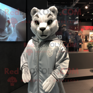 Silver Puma mascot costume character dressed with a Windbreaker and Cufflinks