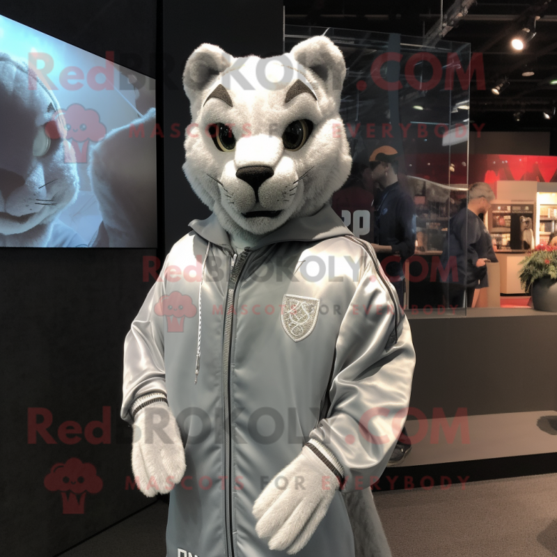 Silver Puma mascot costume character dressed with a Windbreaker and Cufflinks