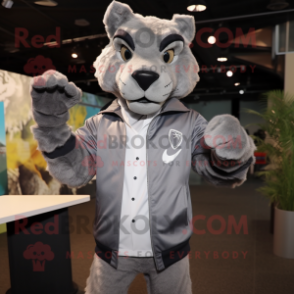 Silver Puma mascot costume character dressed with a Windbreaker and Cufflinks