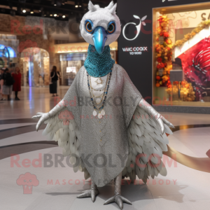 Silver Peacock mascot costume character dressed with a V-Neck Tee and Shawl pins