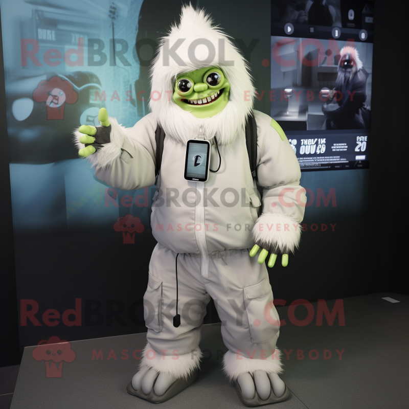 White Frankenstein mascot costume character dressed with a Parka and Smartwatches White Frankenstein mascot costume character dressed with a Parka and Smartwatches