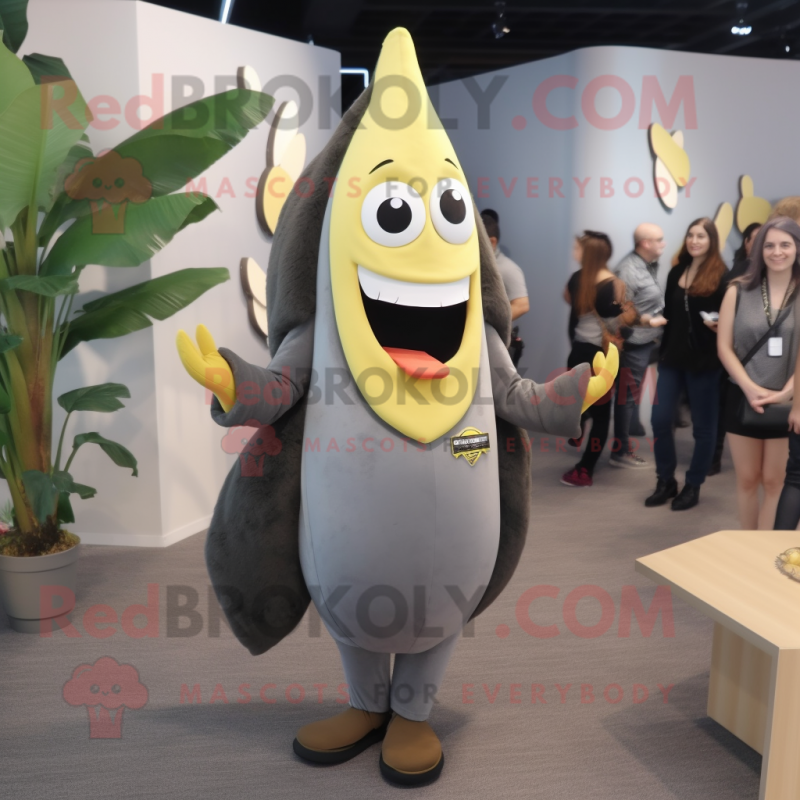 Gray Banana mascot costume character dressed with a Sheath Dress and Lapel pins