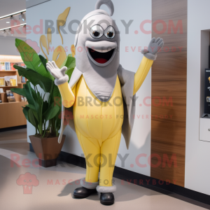 Gray Banana mascot costume character dressed with a Sheath Dress and Lapel pins