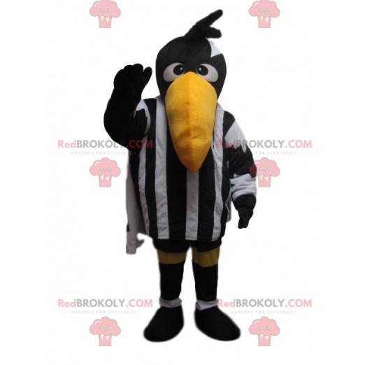 Mascotte de corbeau avec une tenue de sport noire et blanche -