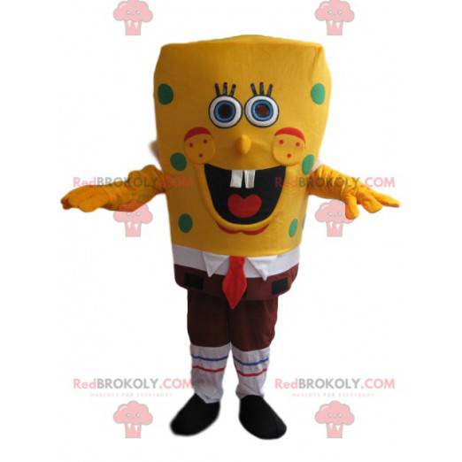 Mascotte SpongeBob erg glimlachend, met groene erwten -