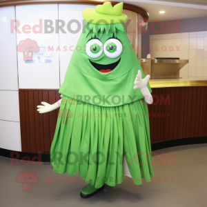 Green Steak mascot costume character dressed with a Pleated Skirt and Shawl pins