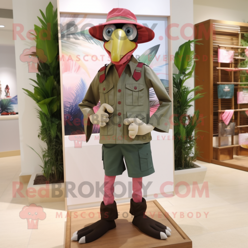 Olive Flamingo mascot costume character dressed with a Bermuda Shorts and Berets