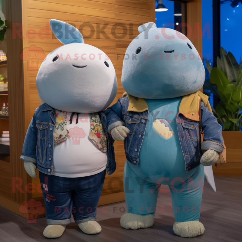 Tan Narwhal mascot costume character dressed with a Boyfriend Jeans and Necklaces Tan Narwhal mascot costume character dressed with a Boyfriend Jeans and Necklaces