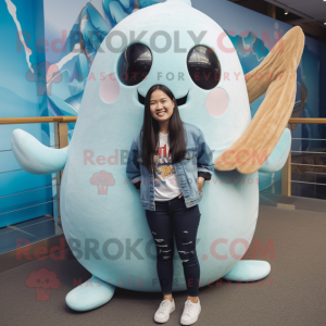 Tan Narwhal mascot costume character dressed with a Boyfriend Jeans and Necklaces