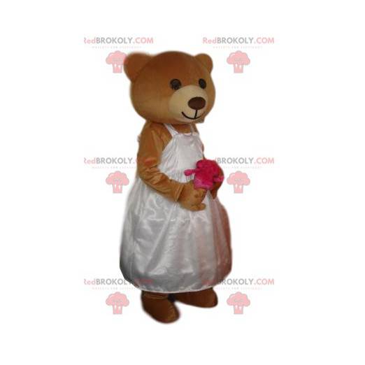 Mascotte d'oursonne marron avec une robe de mariage -