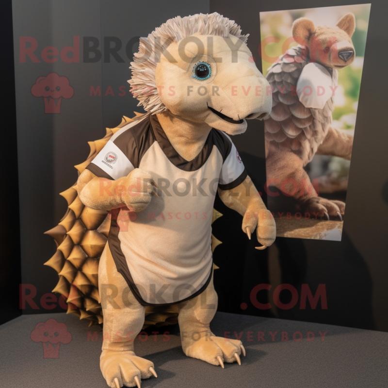 Tan Pangolin mascot costume character dressed with a Rugby Shirt and Hair clips