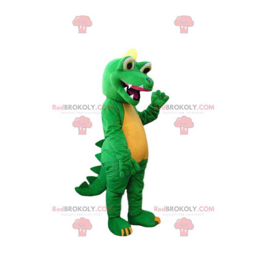 Mascotte dinosauro verde e giallo con un enorme sorriso -