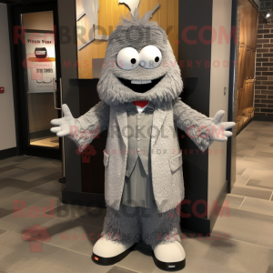 Gray Momentum mascot costume character dressed with a Suit Jacket and Shawl pins