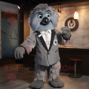 Gray Momentum mascot costume character dressed with a Suit Jacket and Shawl pins