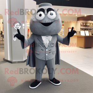 Gray Momentum mascot costume character dressed with a Suit Jacket and Shawl pins