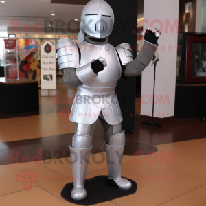 Silver Medieval Knight mascot costume character dressed with a Jeggings and Foot pads