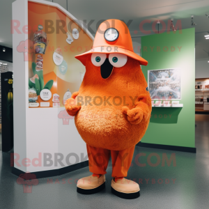 Orange Kiwi mascot costume character dressed with a Long Sleeve Tee and Hat pins