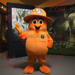 Orange Kiwi mascot costume character dressed with a Long Sleeve Tee and Hat pins