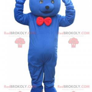 Mascote urso azul com gravata borboleta vermelha -