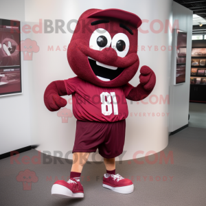 Maroon Candy mascot costume character dressed with a Running Shorts and Shoe clips