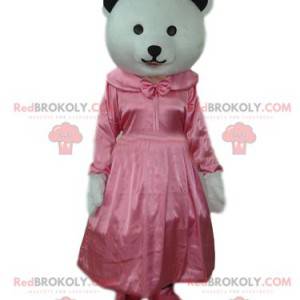 Mascotte d'oursonne blanche avec une robe rose en satin -