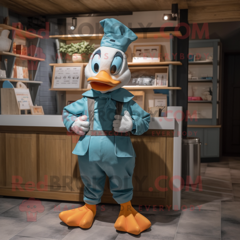 Teal Geese mascot costume character dressed with a Dungarees and Headbands Teal Geese mascot costume character dressed with a Dungarees and Headbands