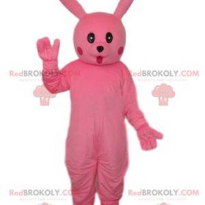 Mascotte coniglio rosa con uno sguardo di meraviglia -