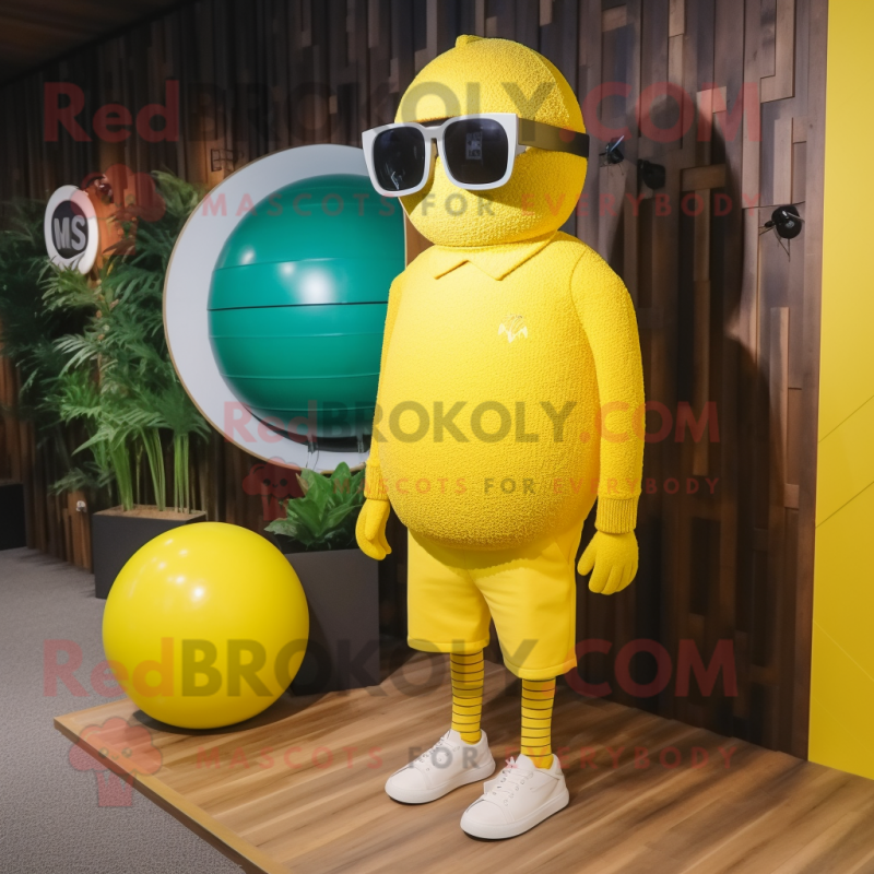 Yellow Golf Ball mascot costume character dressed with a Sweater and Sunglasses