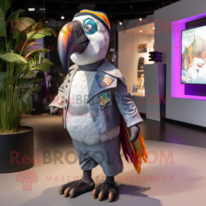 Silver Toucan mascot costume character dressed with a Chinos and Earrings