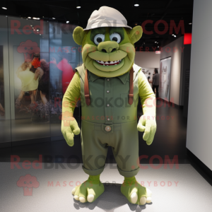 Green Ogre mascot costume character dressed with a Playsuit and Hat pins