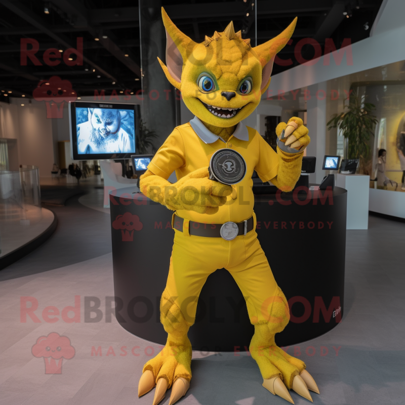 Yellow Gargoyle mascot costume character dressed with a Romper and Smartwatches Yellow Gargoyle mascot costume character dressed with a Romper and Smartwatches