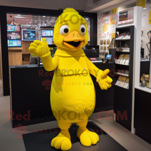 Yellow Canary mascot costume character dressed with a Playsuit and Mittens