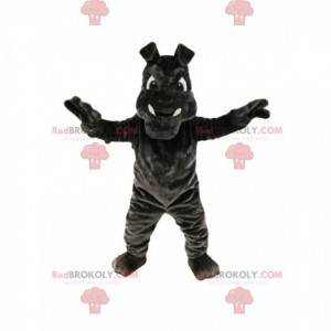 Mascota bulldog gris oscuro con grandes colmillos -