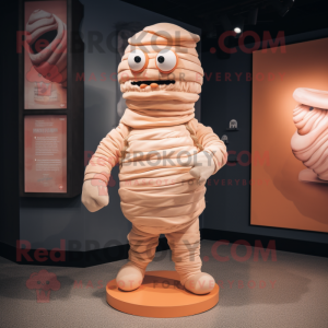 Peach Mummy mascot costume character dressed with a Playsuit and Lapel pins