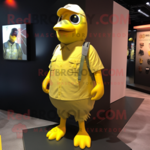 Yellow Pigeon mascot costume character dressed with a Tank Top and Shoe laces