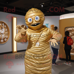 Gold Mummy mascot costume character dressed with a Mom Jeans and Rings