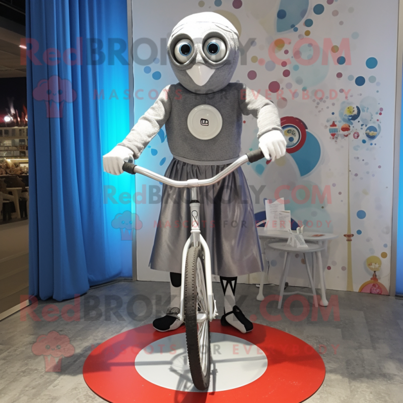 Silver Unicyclist mascot costume character dressed with a Oxford Shirt and Shawls